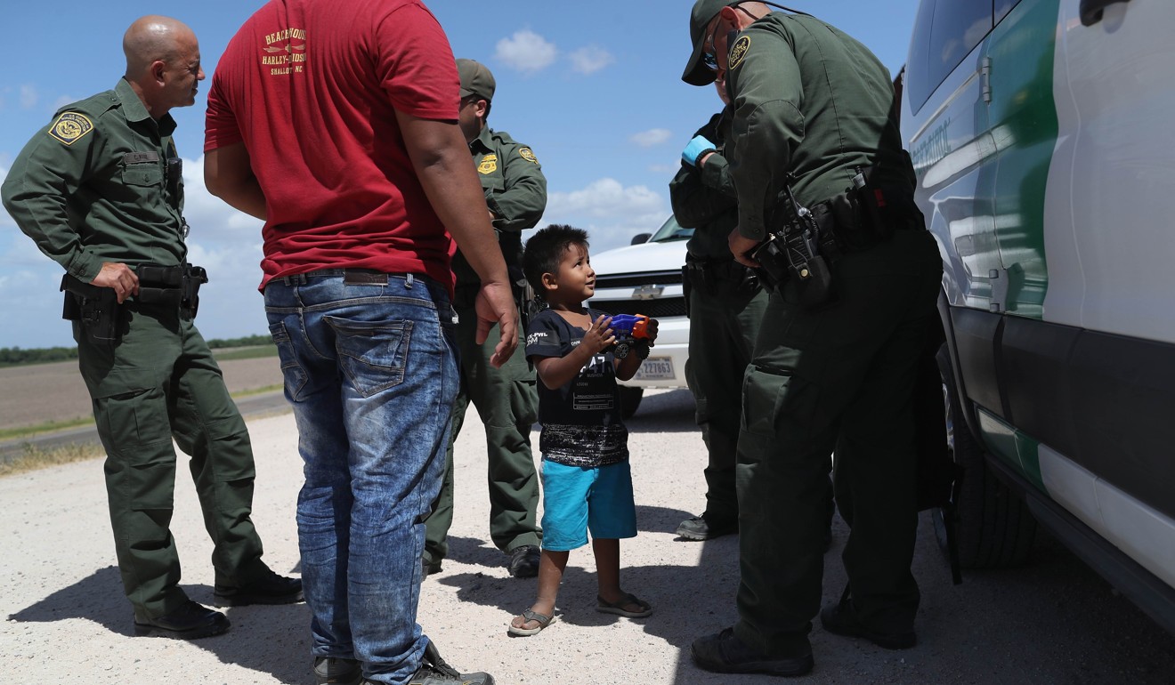 US Border Patrol agents take Central American asylum seekers into custody on June 12 near Mission, Texas. Photo: Agence France-Presse