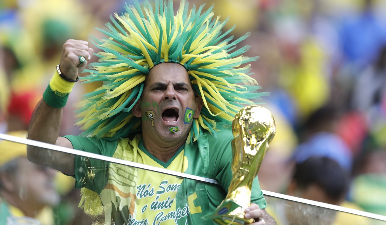 A Brazil fan celebrates after the game. Photo: AP