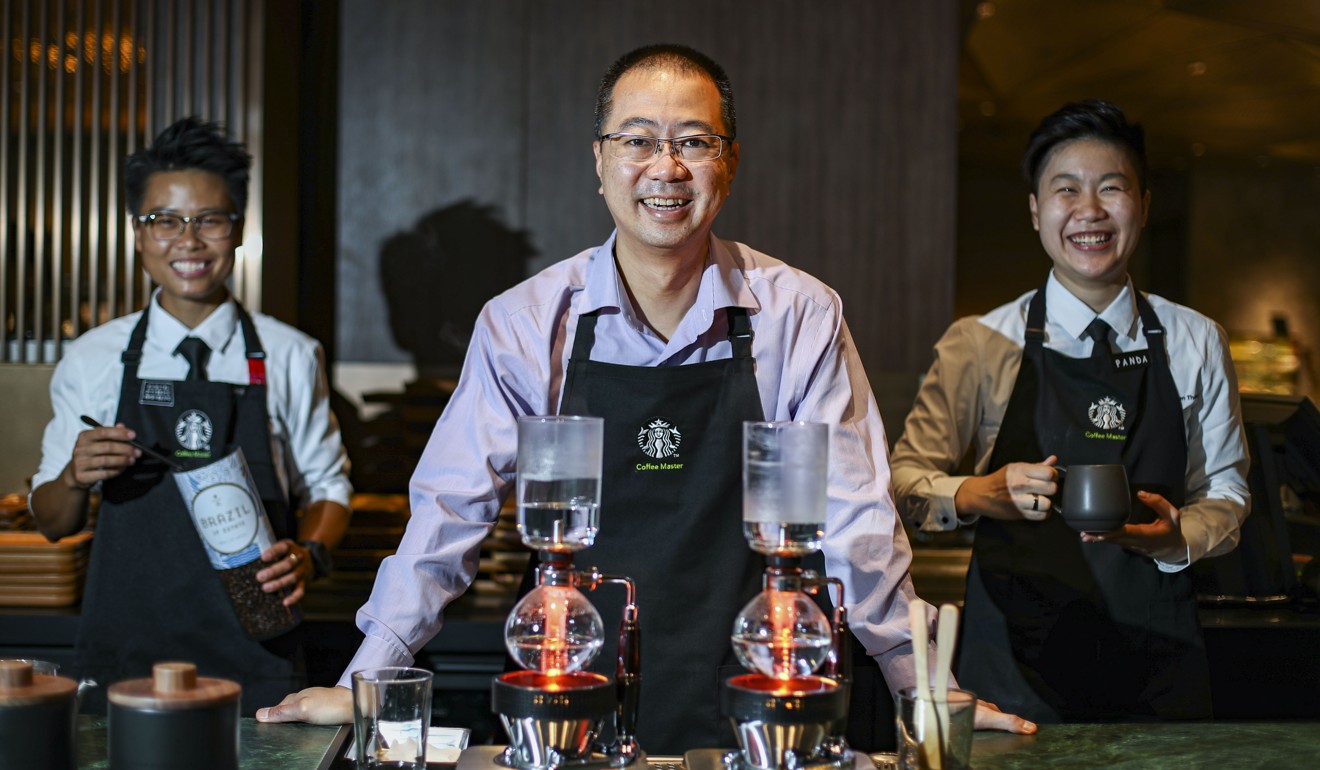 Norbert Tan (centre), executive director of Starbucks Hong Kong. Photo: Nora Tam