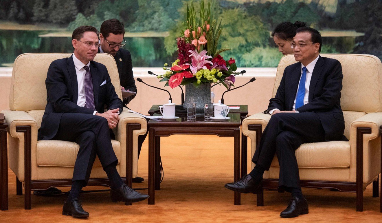 Jyrki Katainen attends a meeting with Chinese Premier Li Keqiang at the Great Hall of the People on Monday. Photo: AFP
