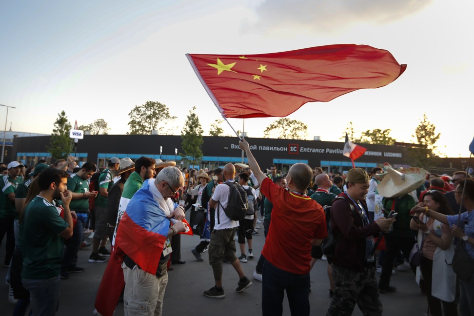 A Chinese fan waves China’s national flag after the match between Germany and Mexico at the World Cup outside the Luzhniki Stadium in Moscow, Russia. Photo: AP