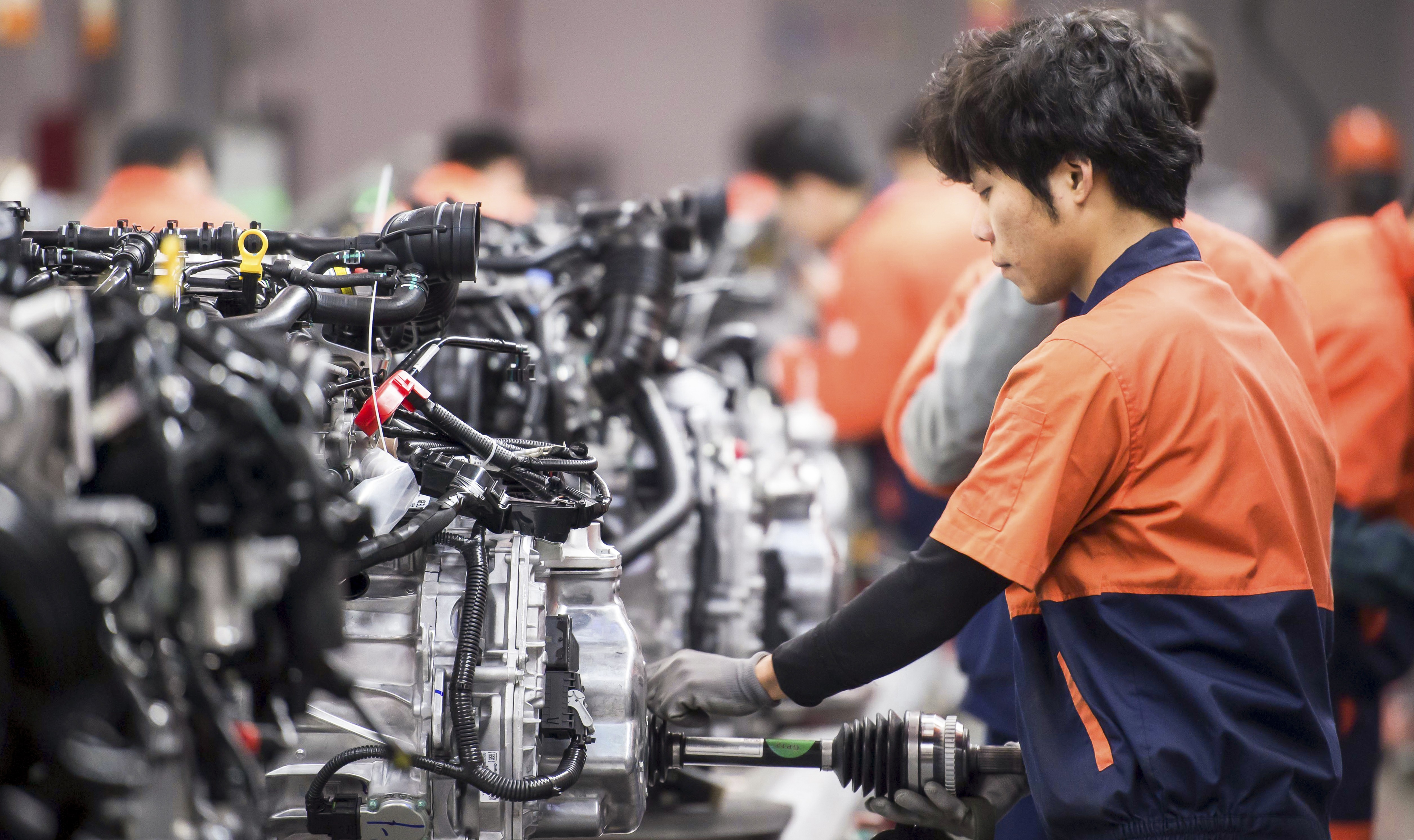 Workers assemble engines at a Geely Automobile Manufacturing Plant in Zhejiang province in March 2017. The Made in China plan aims to accelerate innovation and upgrade the quality of manufacturing in the country. Photo: Shutterstock