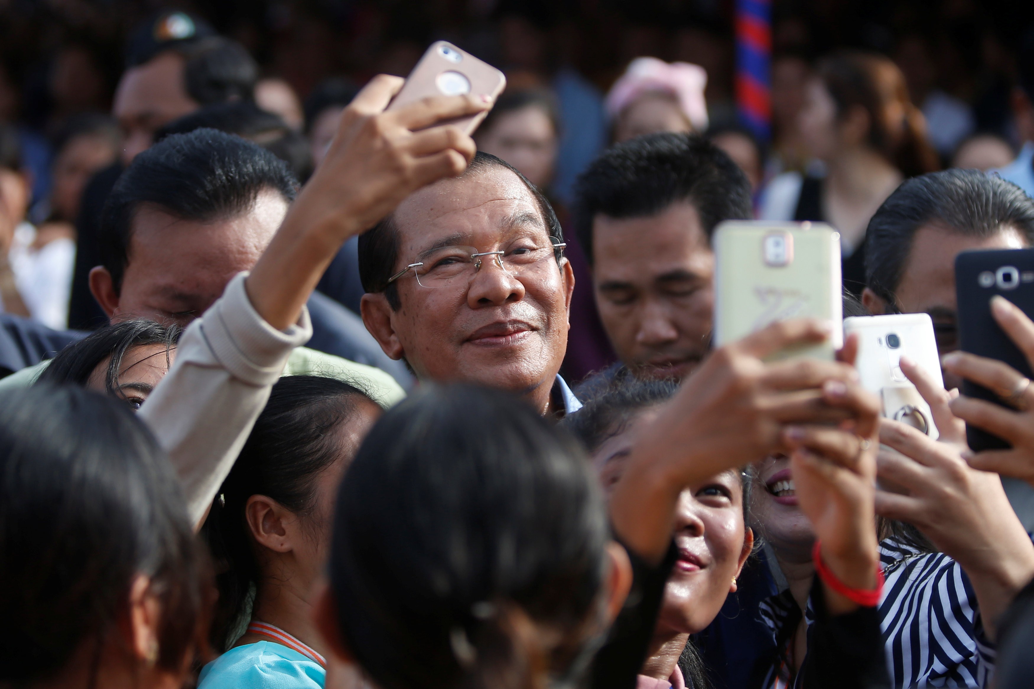 Garment workers welcome Cambodian Prime Minister Hun Sen during a rally in Kandal province. Photo: Reuters