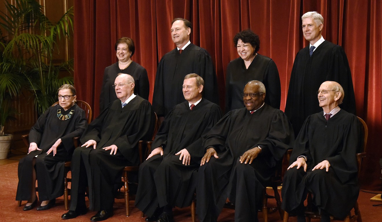 Members of the US Supreme Court pose for a group photograph on June 1. Front row, seated from left: Associate Justice Ruth Bader Ginsburg, Associate Justice Anthony M. Kennedy, Chief Justice of the United States John G. Roberts, Associate Justice Clarence Thomas, and Associate Justice Stephen Breyer. Standing behind from left: Associate Justice Elena Kagan, Associate Justice Samuel Alito Jnr, Associate Justice Sonia Sotomayor, and Associate Justice Neil Gorsuch. Photo: Abaca Press via TNS