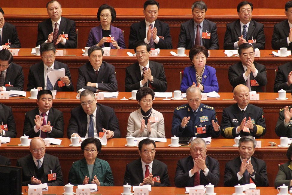 Hong Kong Chief Executive Carrie Lam Cheng Yuet-ngor (second row, centre) attends the first session of China’s 13th National People's Congress opening in Beijing on March 5. Photo: Simon Wong/SCMP