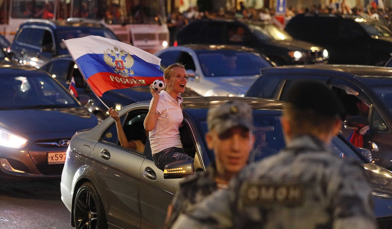 A Russian supporter celebrates the victory in Moscow city centre. Photo: Reuters