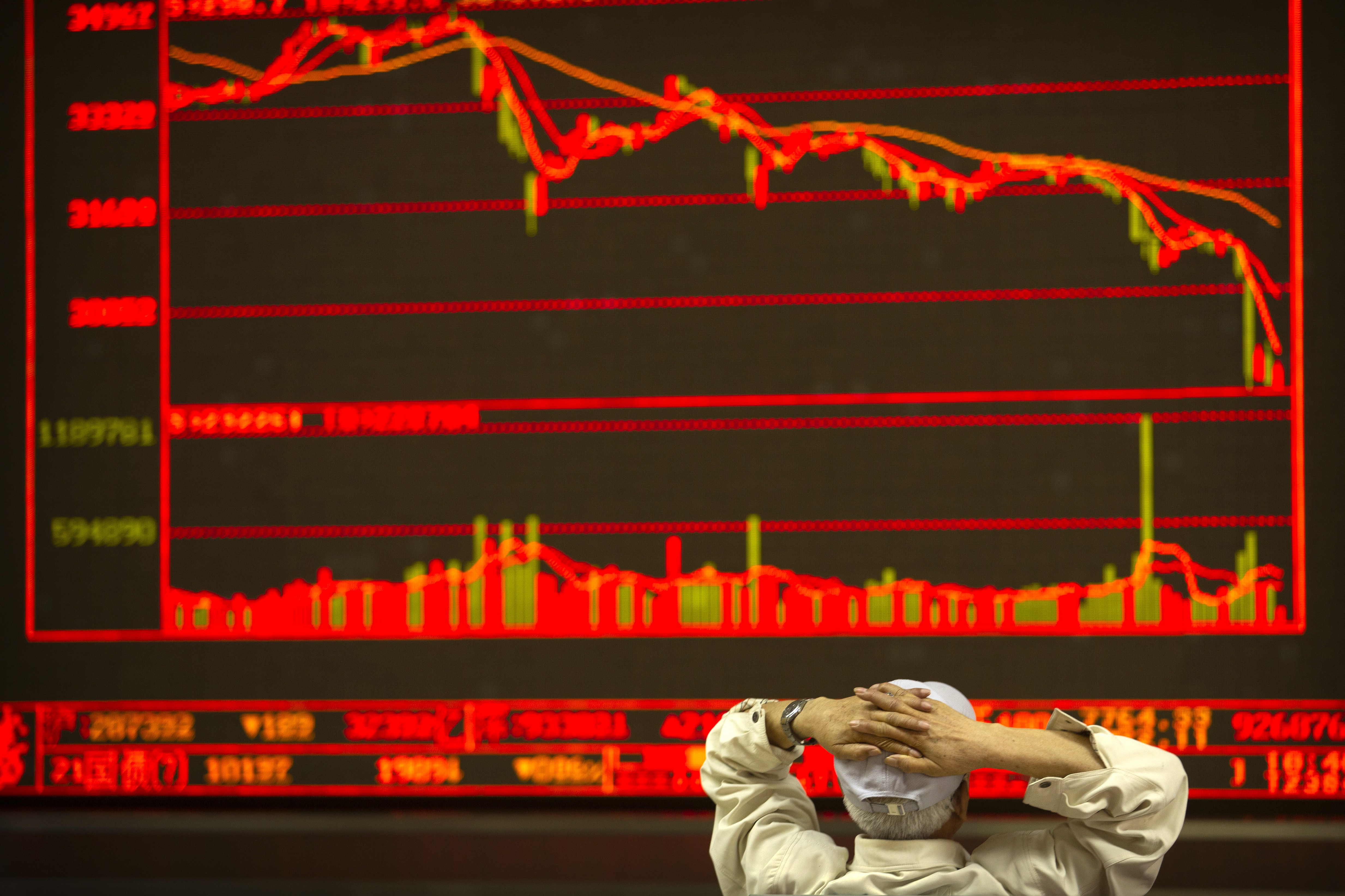 A Chinese investor monitors stock prices at a brokerage house in Beijing on June 22. The Shanghai Composite Index has ranked as the worst performer among the world’s major markets this year. Photo: AP