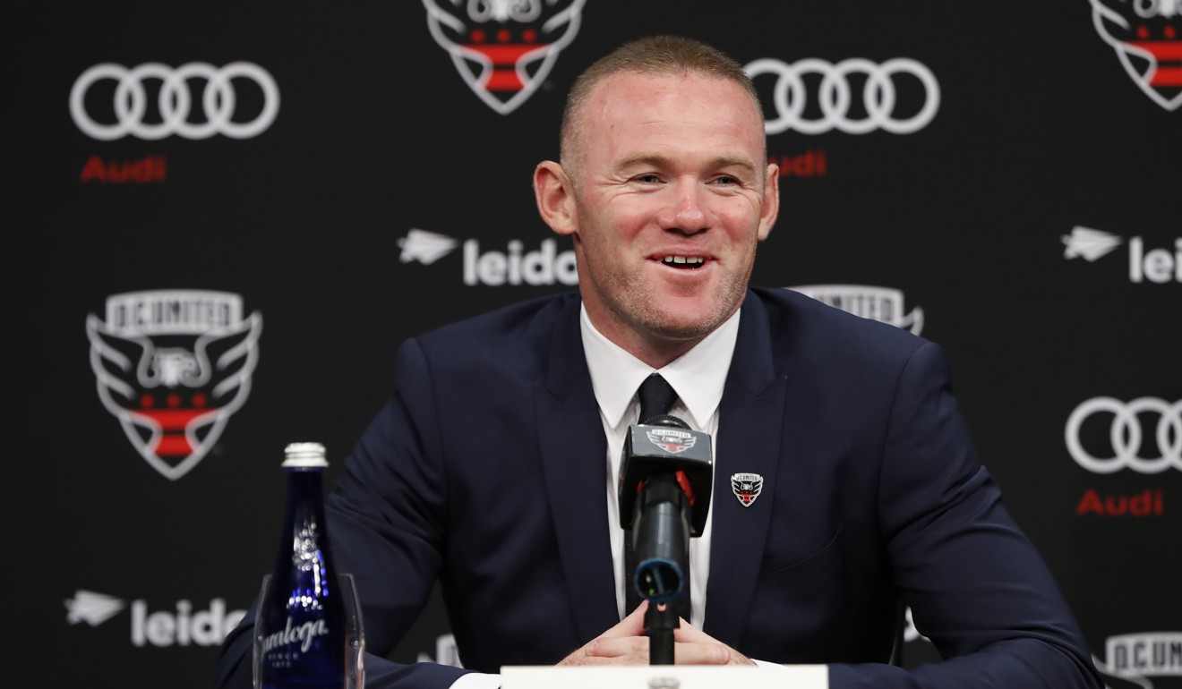 DC United forward Wayne Rooney smiles while speaking at his introduction press conference. Photo: Reuters