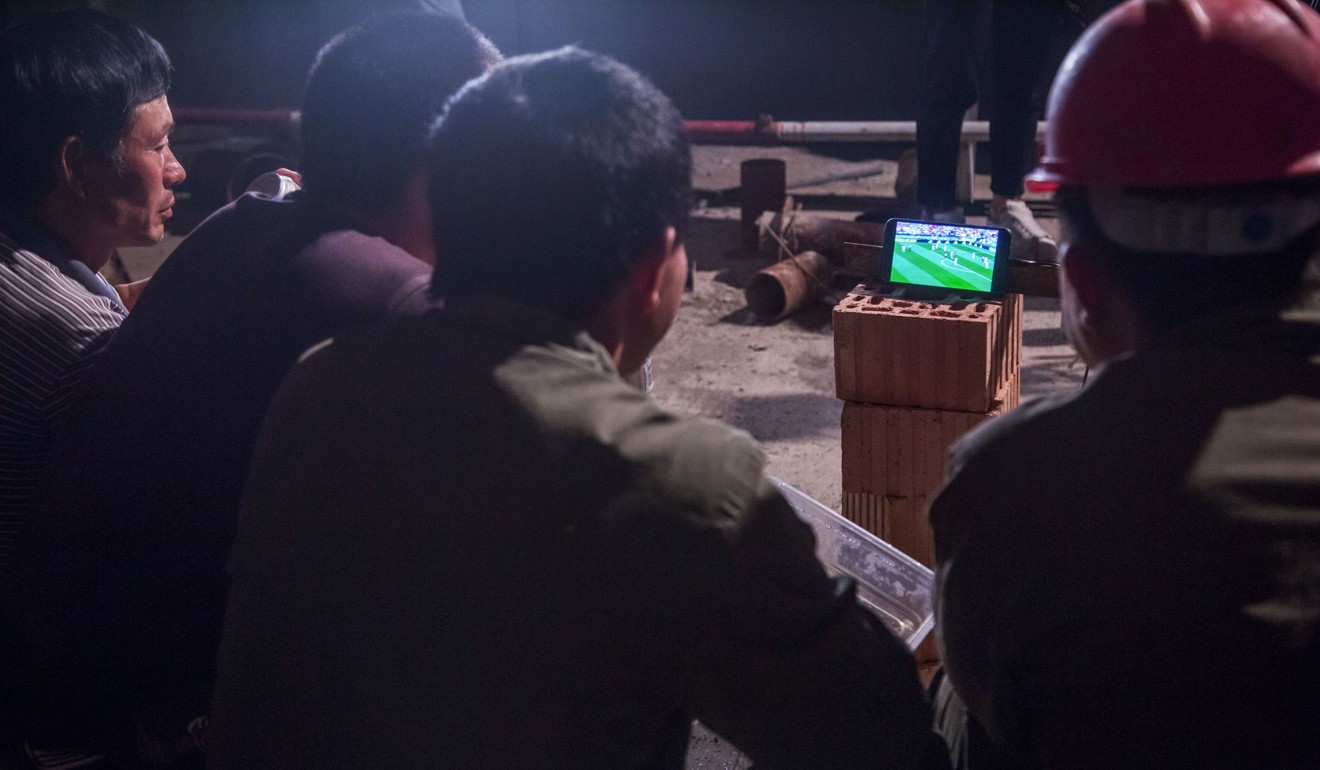 Chinese workers watching the World Cup at a construction site in Hangzhou in China’s eastern Zhejiang province. Photo: AFP