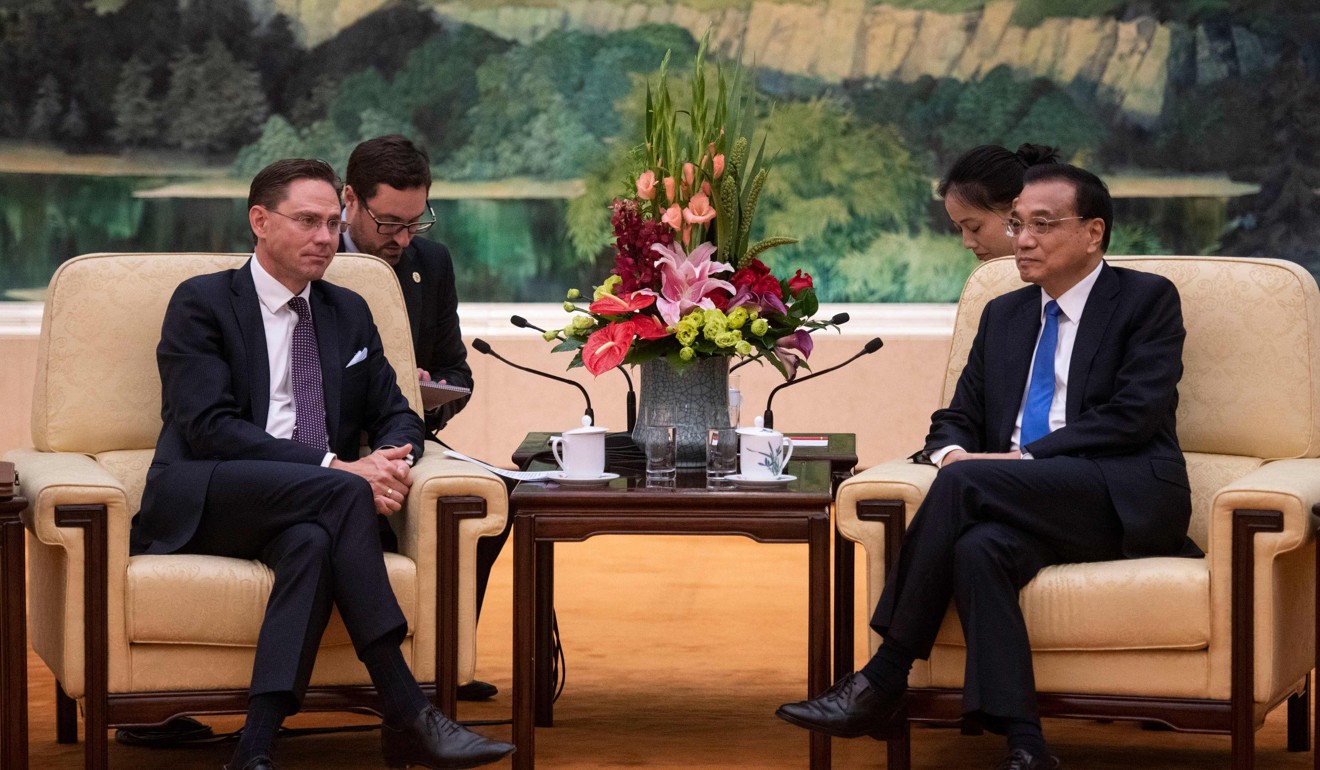 European Commission Vice-President Jyrki Katainen (left) attends a meeting with China’s Premier Li Keqiang at the Great Hall of the People in Beijing on June 25. Photo: AFP