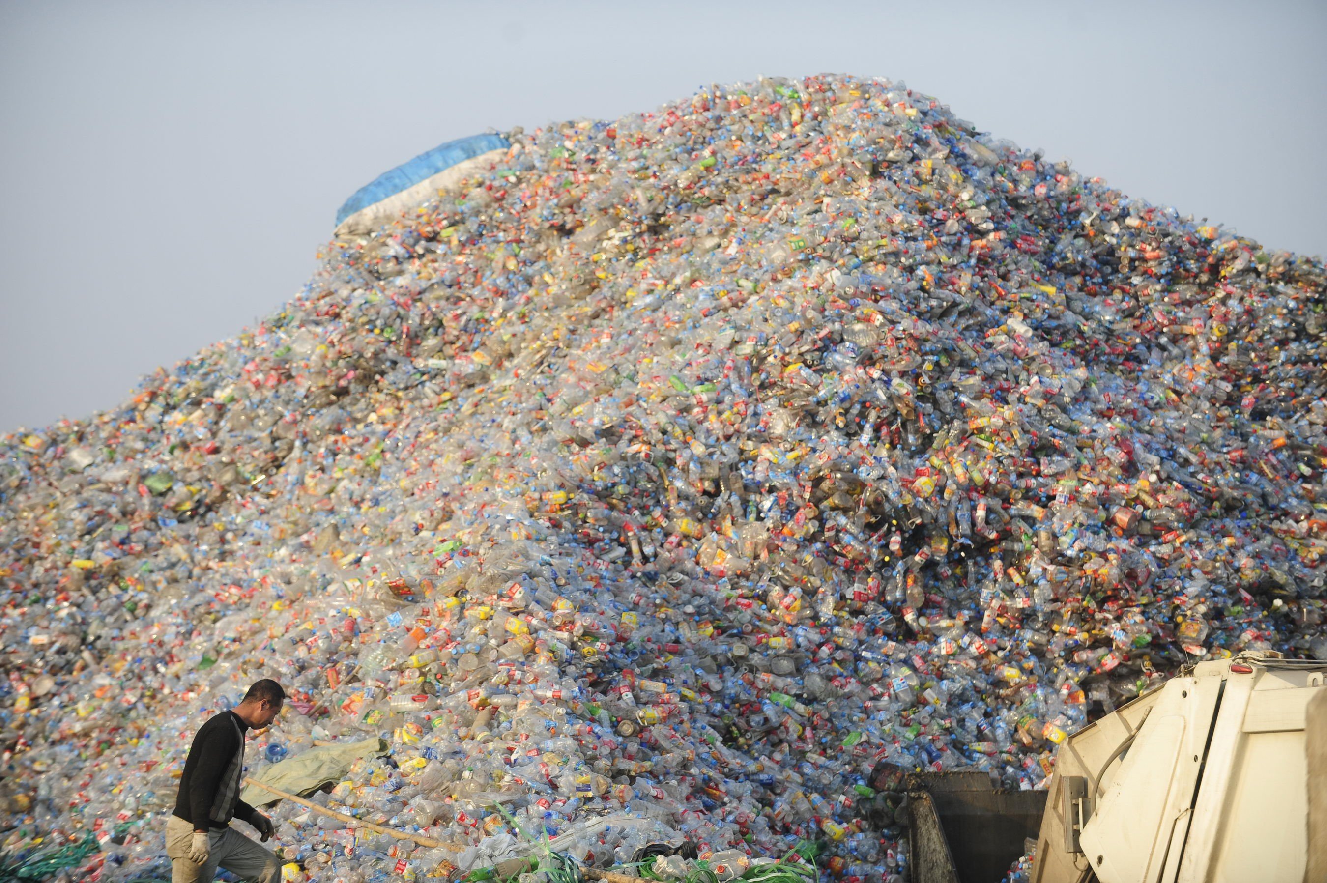 A worker inspects plastic for recycling at a factory in Wuhan, in Hubei province, China in 2010. Picture: Alamy