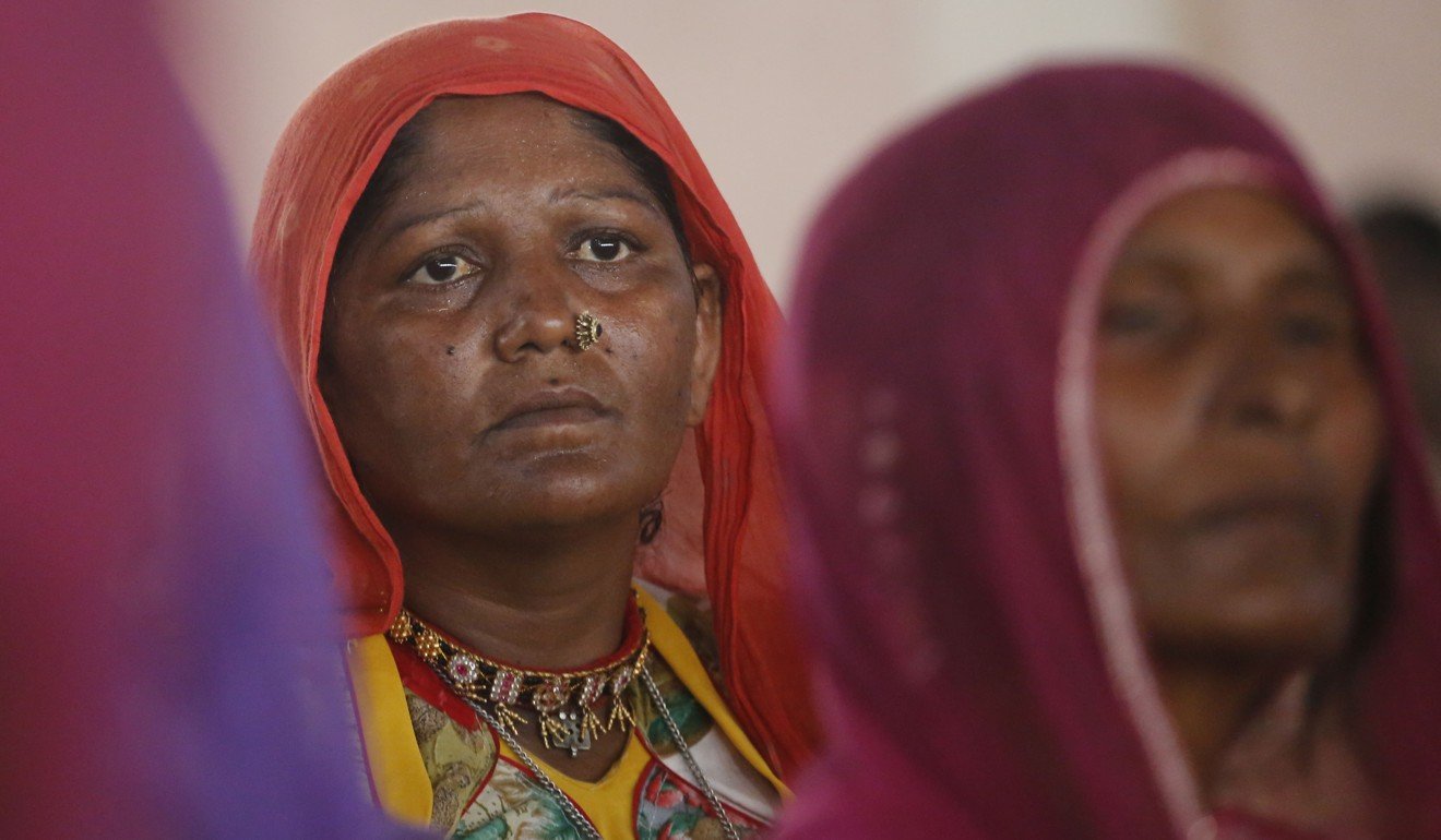 Indian women attend a meeting to condemn recent incidents of mob attacks, in Ahmadabad, India. Photo: AP