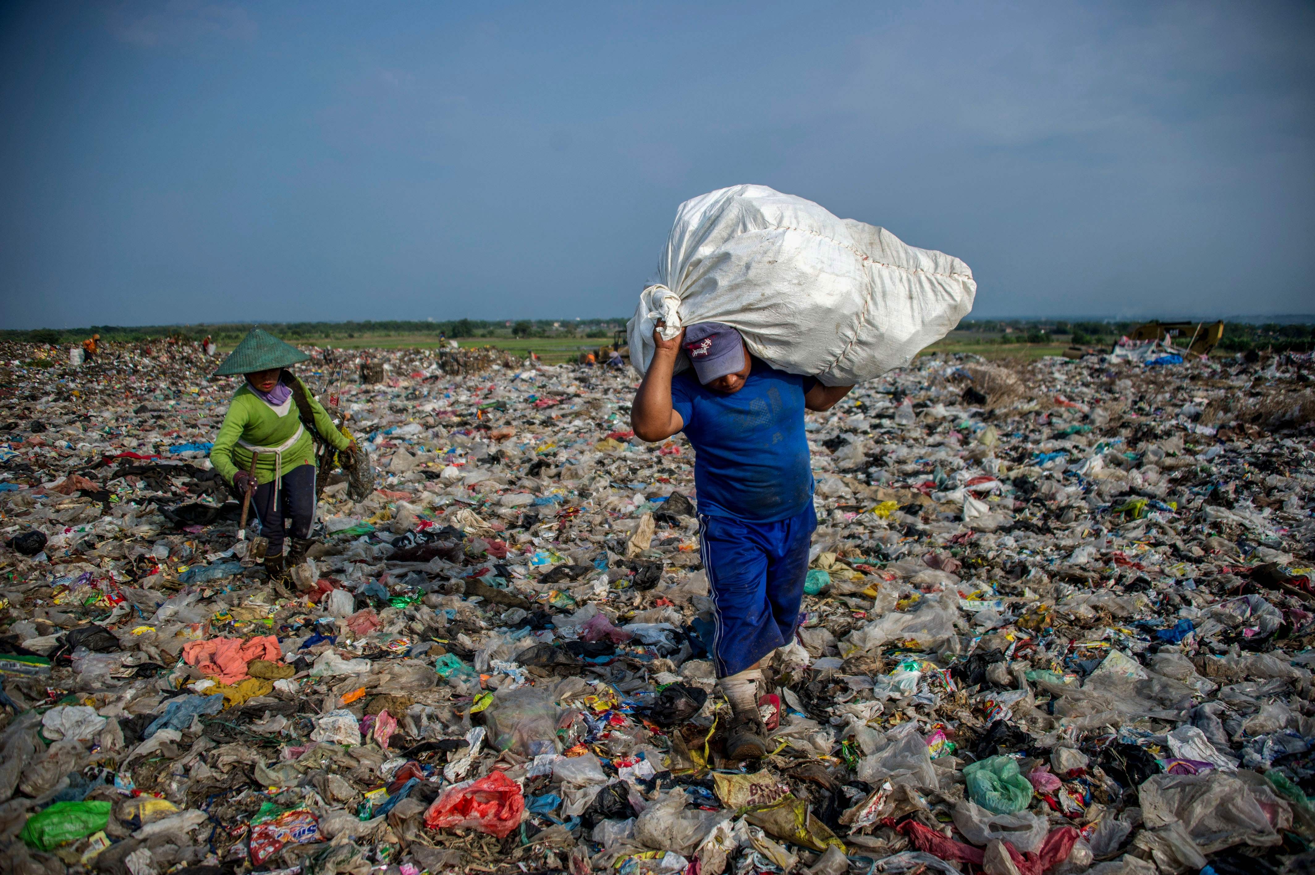 Scavengers collect waste at Sidoarjo garbage dump in East Java, Indonesia, on June 5. About eight million tonnes of plastic waste is dumped into the world’s oceans every year. Photo: AFP