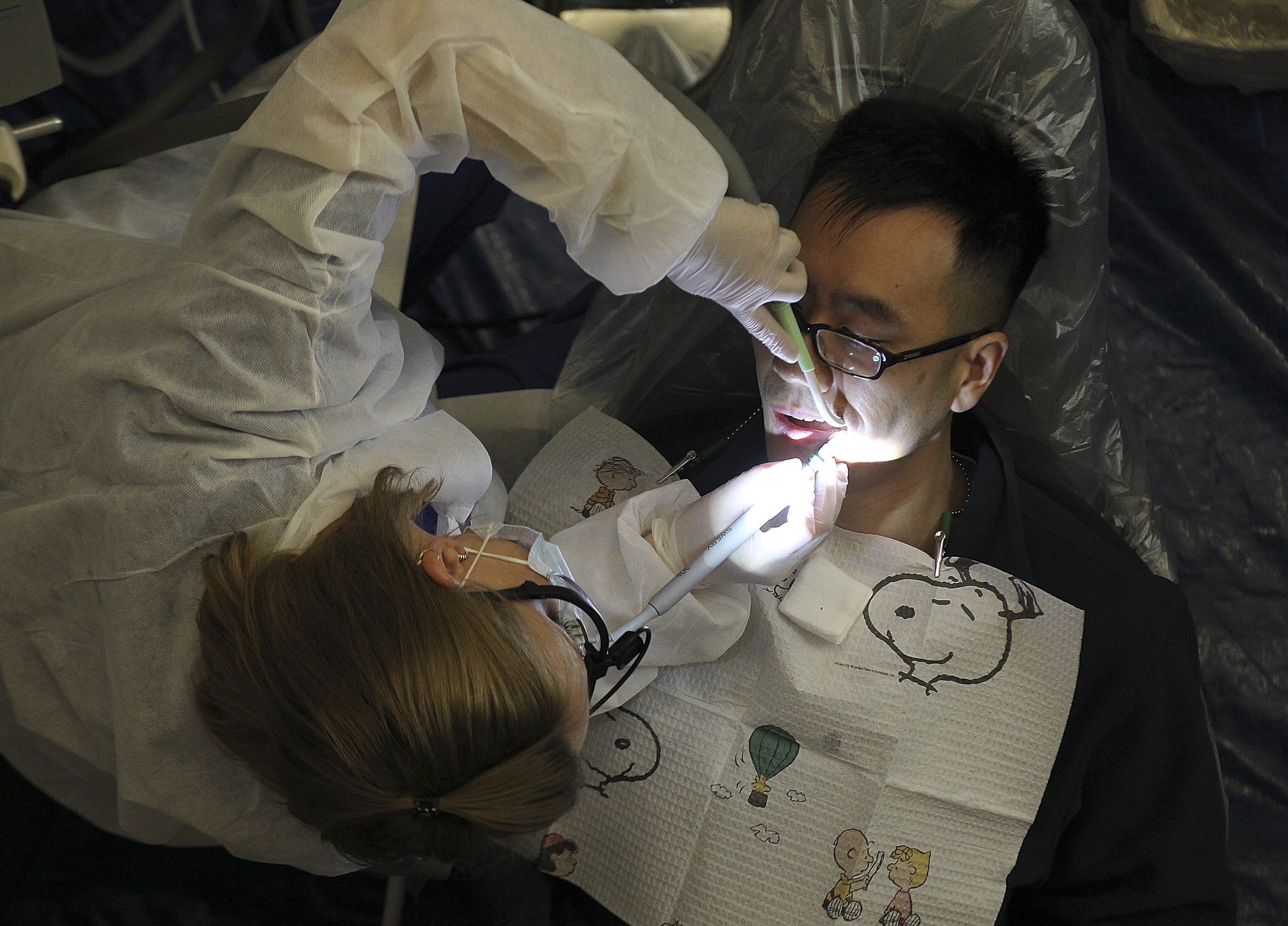 A dentist performs a procedure during a free clinic in Oakland, California, in March 2012. Investors should take their cue from dental advice on regular maintenance and tailor their portfolios to the changing market conditions. Photo: Getty Images/AFP