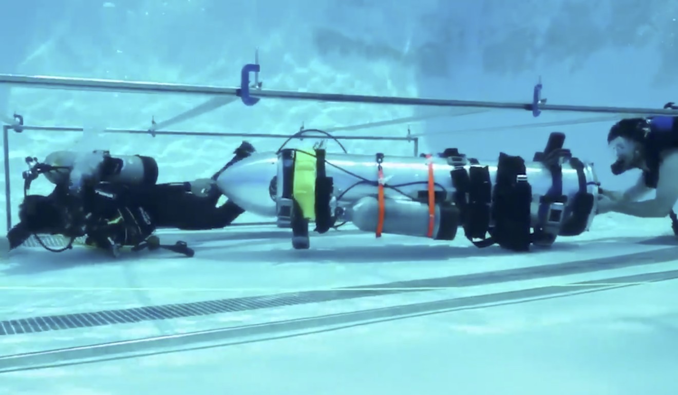 This frame grab from video tweeted by Elon Musk shows a “tiny kid-sized submarine” being tested in a pool. Photo: AP