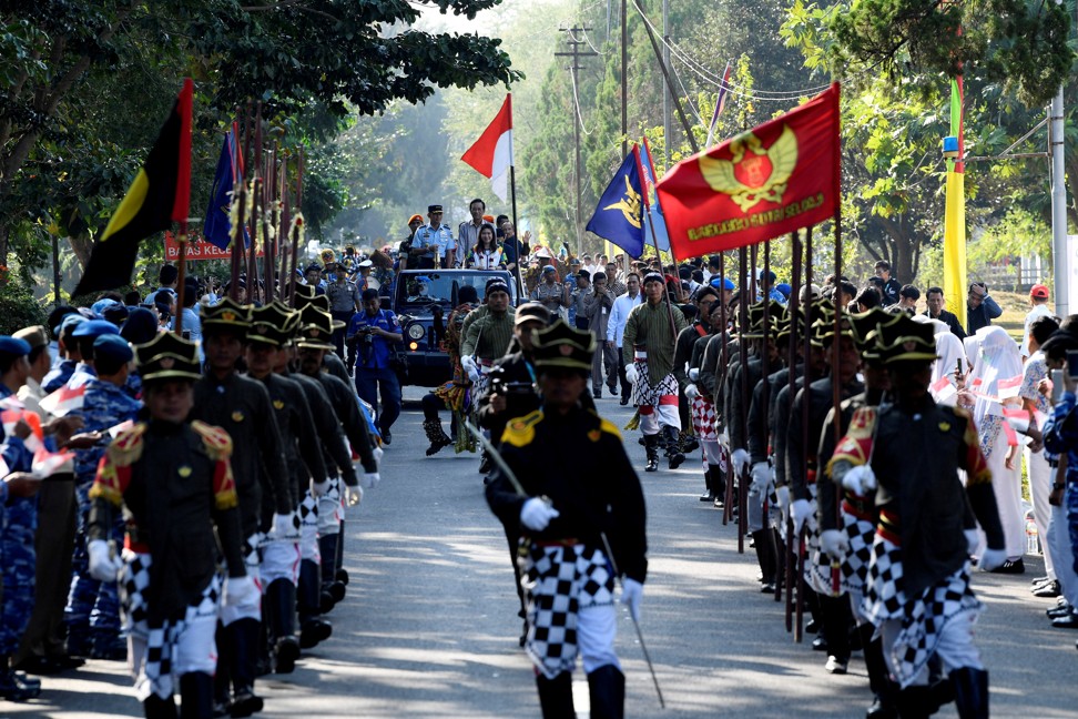 A parade marks the arrival of the Asian Games torch from India ahead of the 18th Asian Games. Photo: Reuters