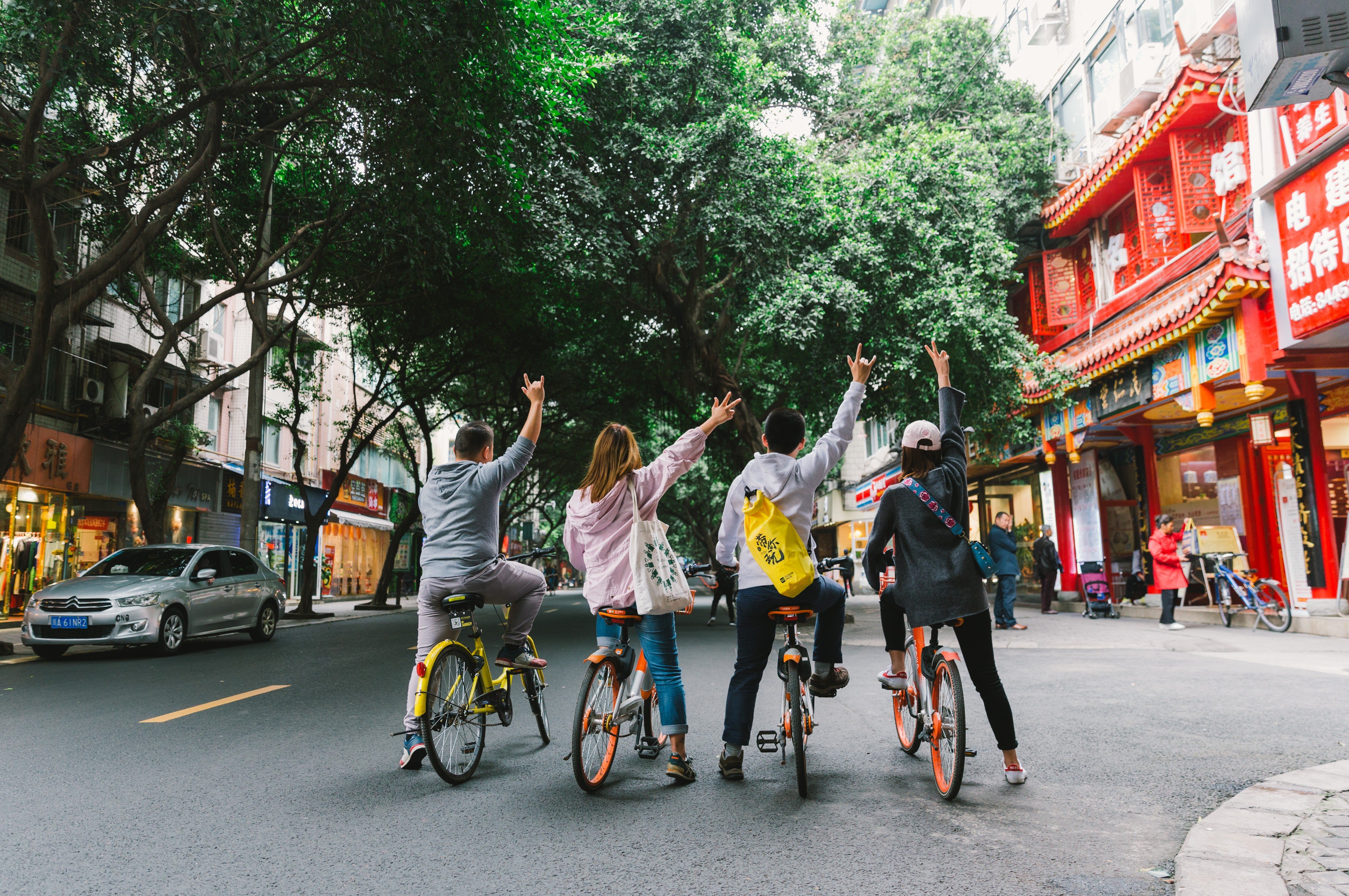 Tourists and their Bikego guide tour the back alleys of Chengdu.