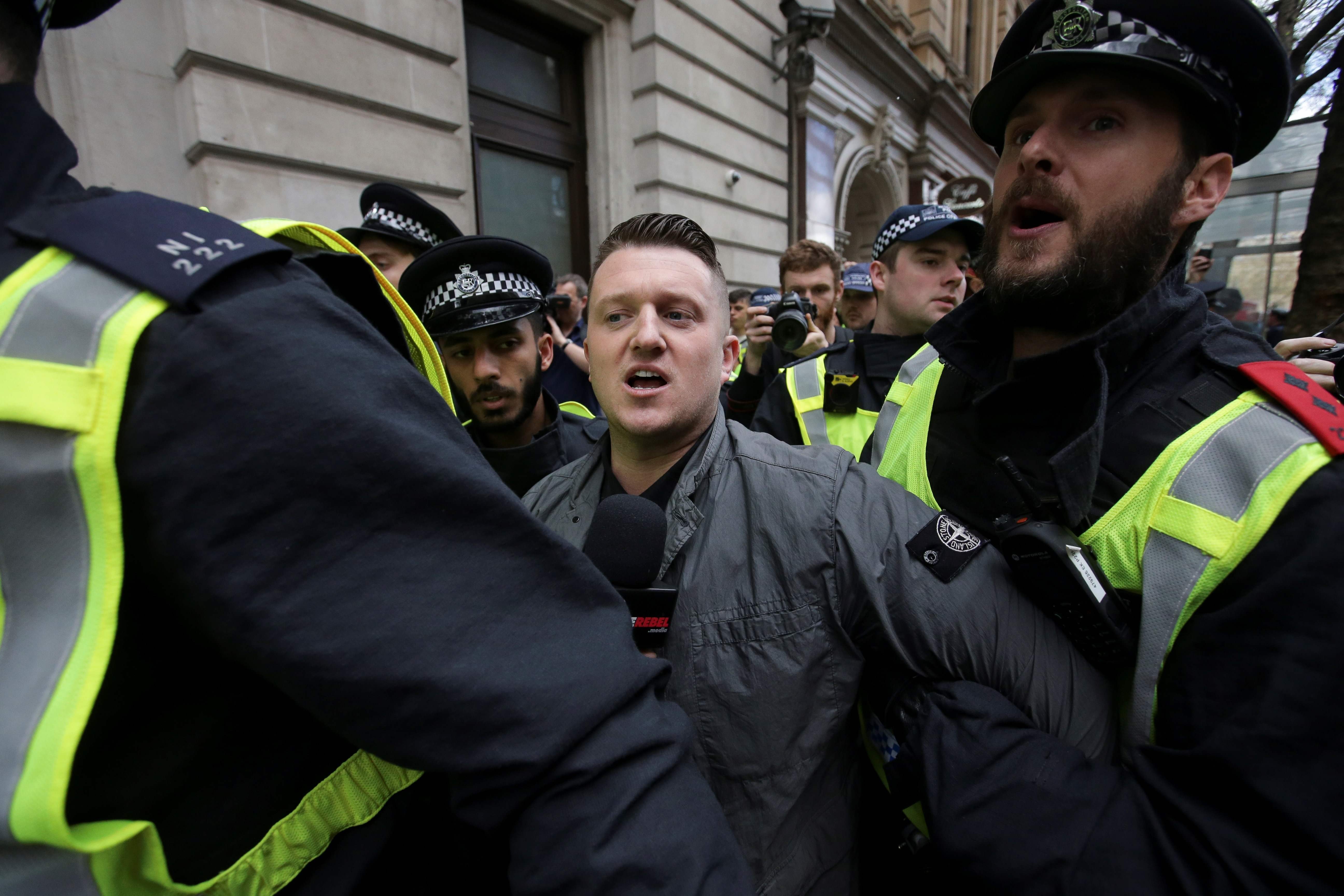 Stephen Christopher Yaxley-Lennon, aka Tommy Robinson, former leader of the right-wing EDL, is escorted away by police from a rally in central London in 2017. Photo: AFP