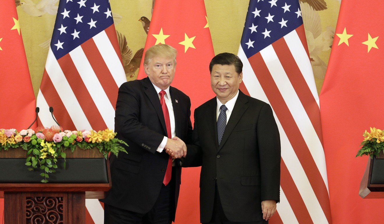 US President Donald Trump and Chinese President Xi Jinping shake hands in Beijing. Photo: Bloomberg