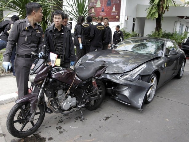 Thai police officers inspect a Ferrari car allegedly owned by Vorayuth Yoovidhya (not in picture) in September 2012. Photo: EPA