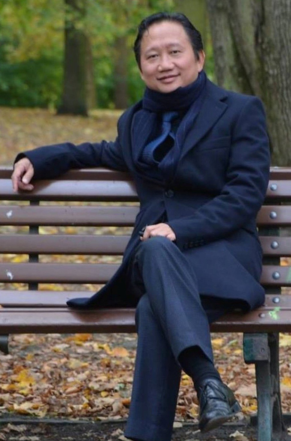 Trinh Xuan Thanh, a former official at state oil company PetroVietnam, sits on a park bench in Berlin in this undated photo. Photo: Reuters