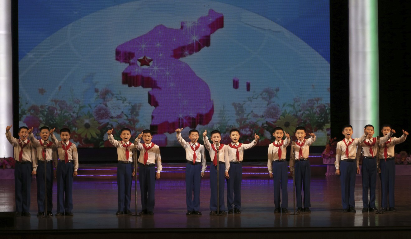 Boys perform on stage during a presentation at the Mangyongdae Children’s Palace in Pyongyang. Photo: AP