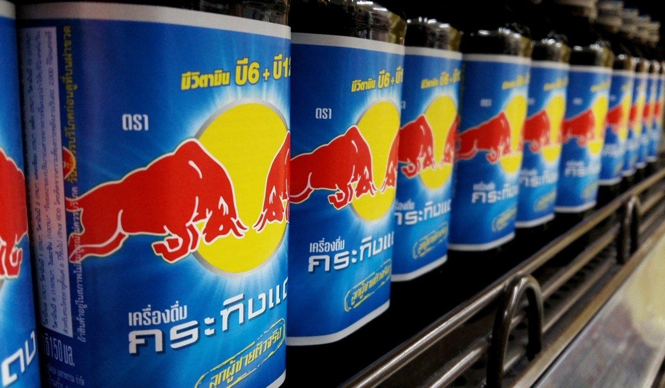 Bottles of Classic Krating Daeng in a Thai supermarket.