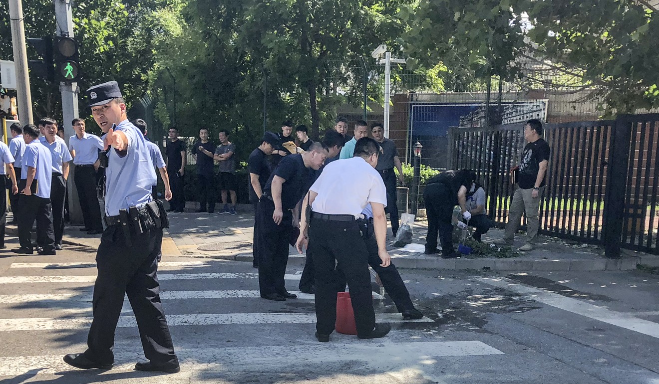 Police attend the site of a blast outside the US embassy in Beijing on Thursday afternoon. Photo: Yu Xinyan