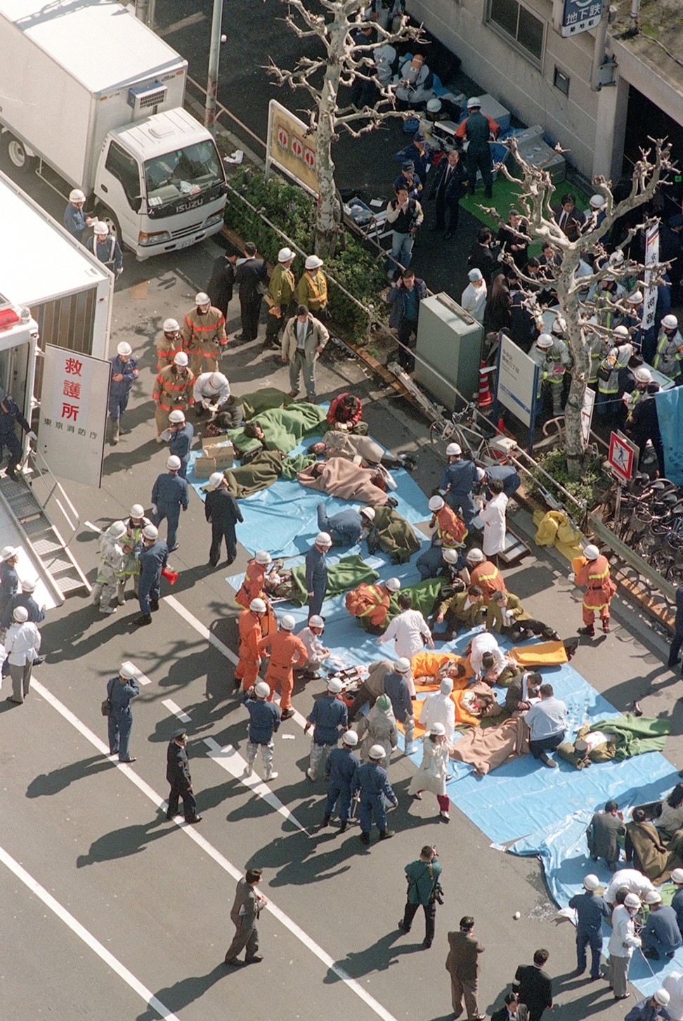 In 1995, subway passengers affected by sarin nerve gas were treated near Tsukiji subway station in Tokyo. Photo: Kyodo