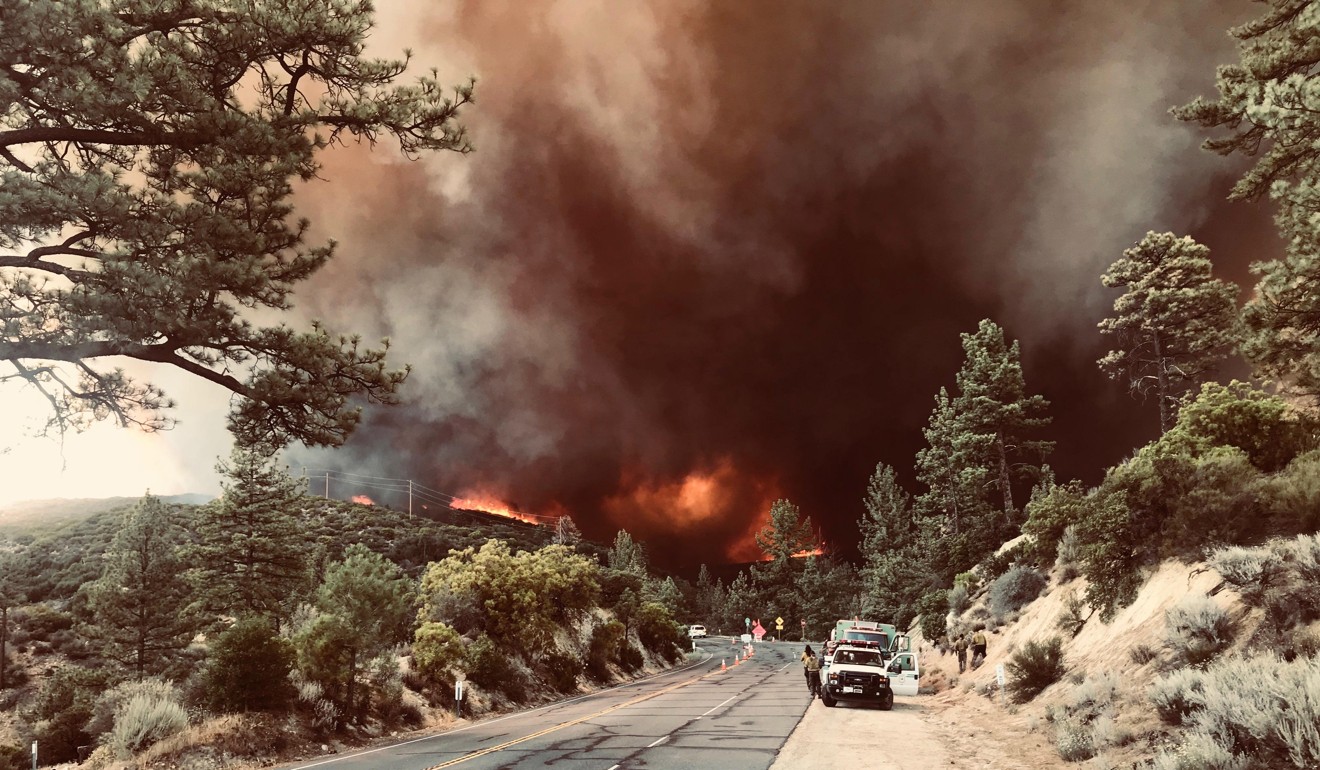 Firefighters moving in to fight a blaze caused by the Cranston Fire near Idyllwild in San Bernardino County. Photo: EPA