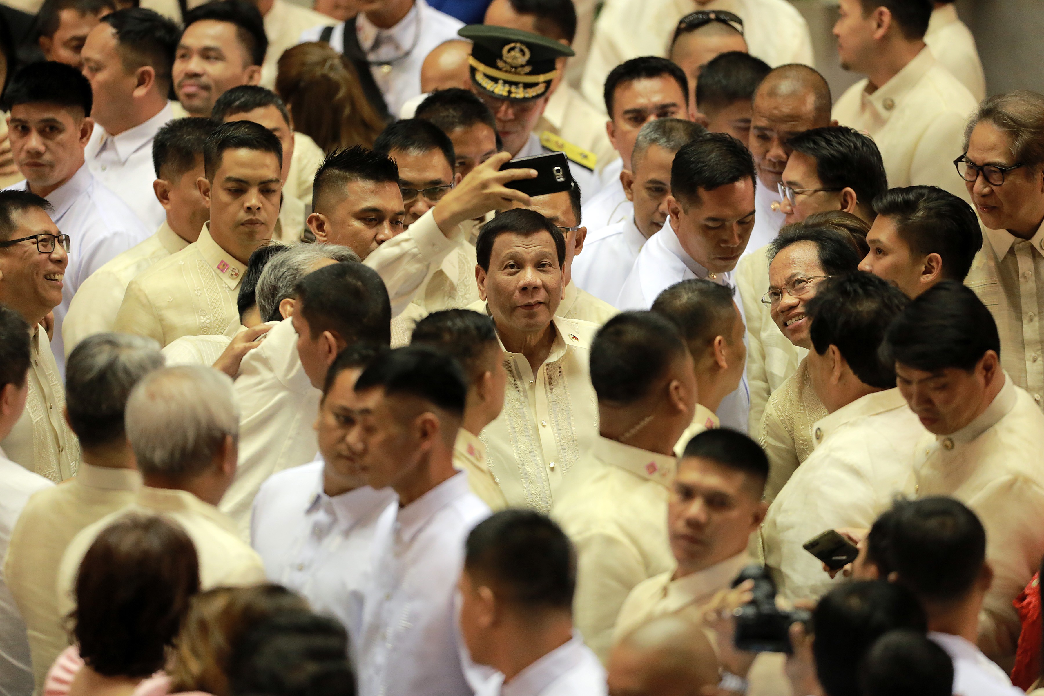 Philippine President Rodrigo Duterte, cetnre, is seen after delivering his third State of the Nation Address. Photo: Xinhua