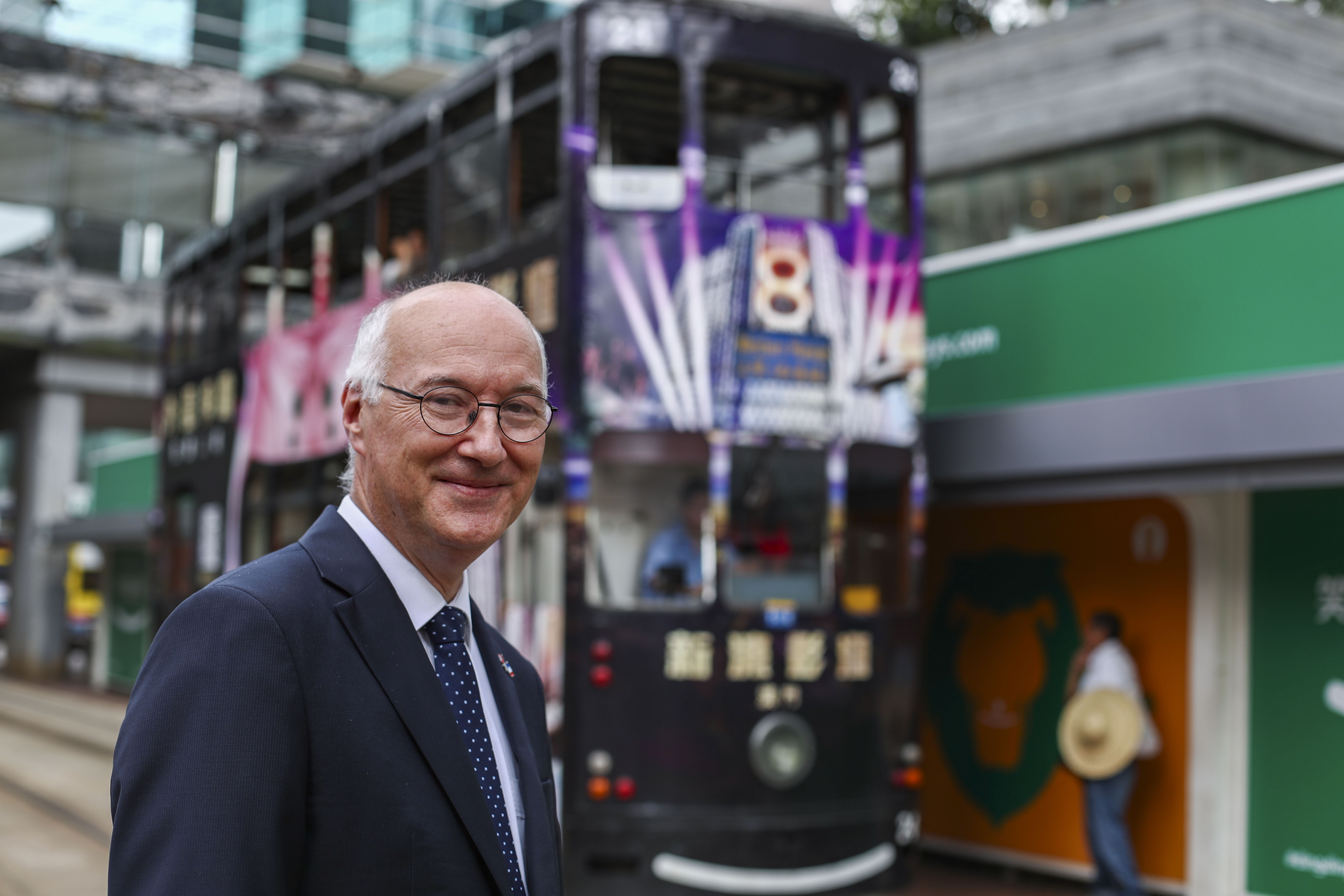 Eric Berti, consul general of France in Hong Kong and Macau, stands at a tram stop. The iconic Hong Kong trams are owned by a French company. Photo: Nora Tam