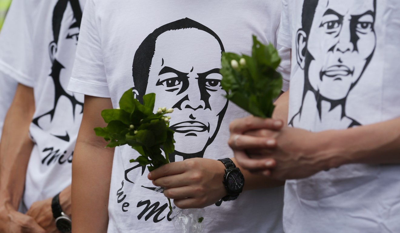 Activists commemorate the two-year anniversary of the death of dissident Li Wangyang outside the central government liaison office, in Sai Ying Pun. Picture: Nora Tam