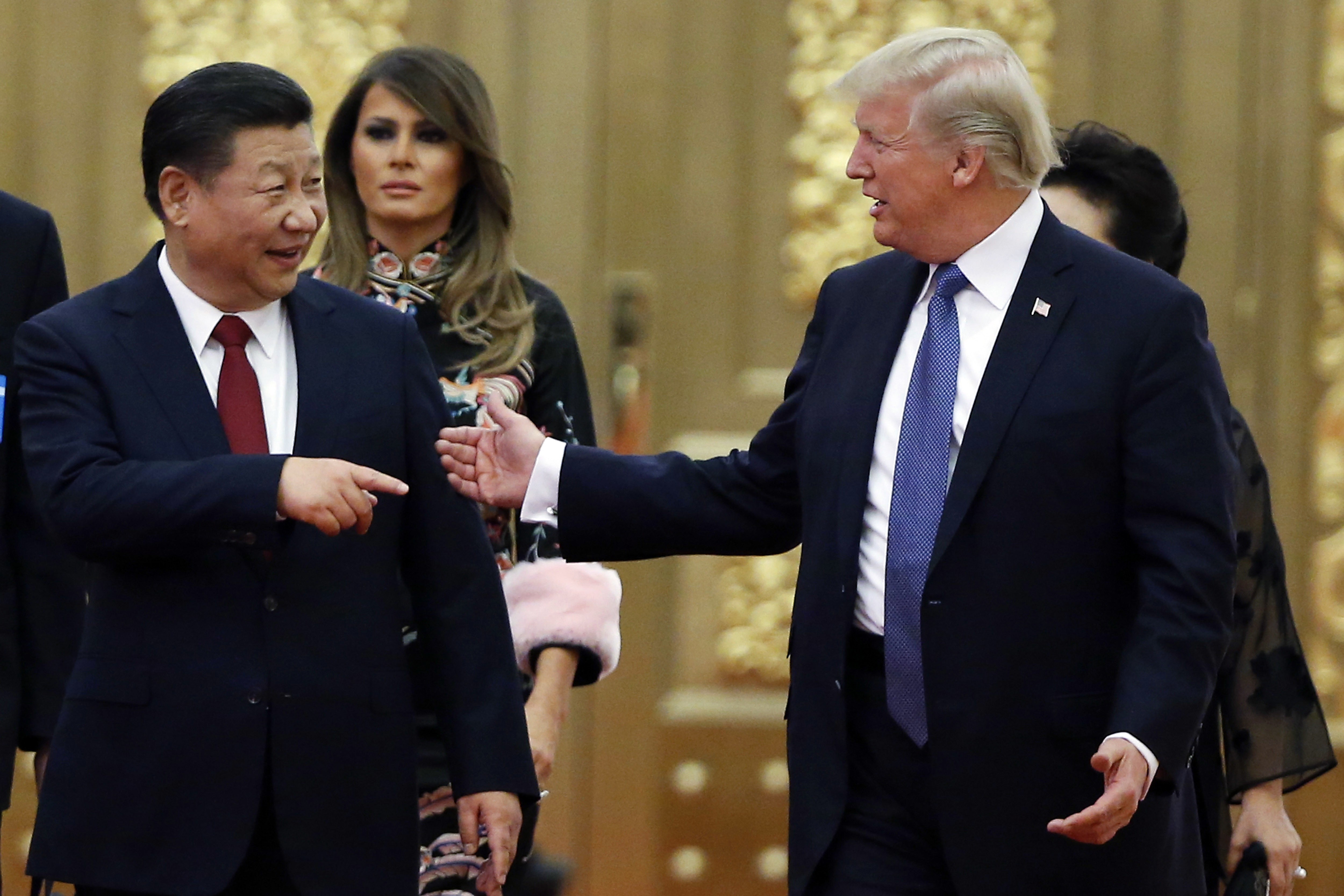 US President Donald Trump and China's President Xi Jinping arrive for the state dinner at the Great Hall of the People in Beijing on November 9, 2017. Photo: AP