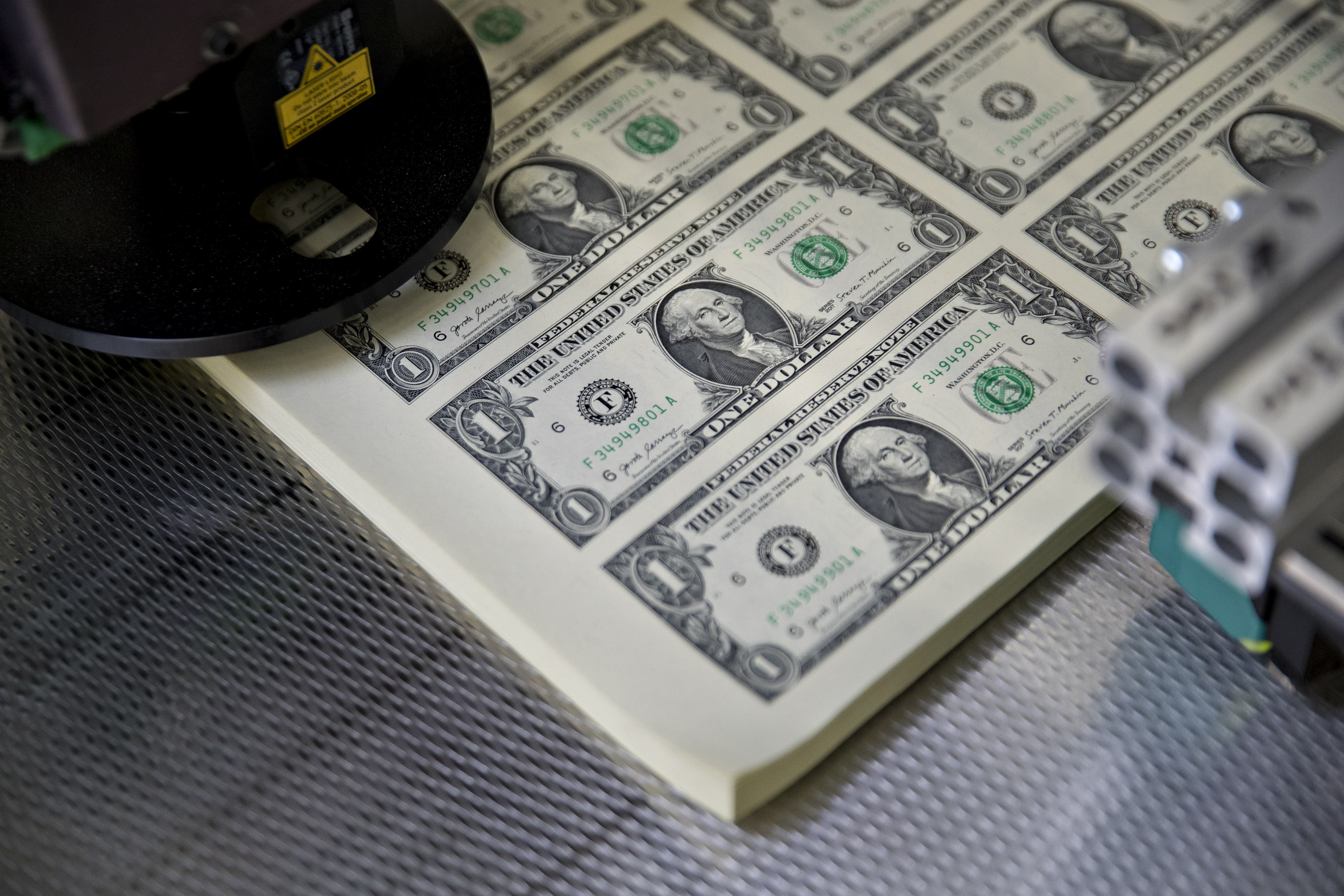 Stacks of uncut sheets of US$1 dollar notes sit in a machine at the US Bureau of Engraving and Printing in Washington on November 15. The dollar’s value has been strong this year, despite expectations and most external indicators. Photo: Bloomberg