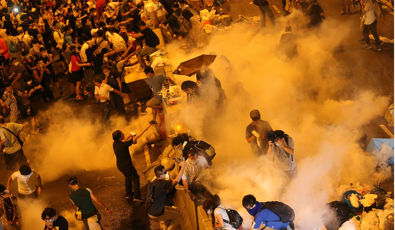 Police fire tear gas at protesters at the start of the Occupy campaign in 2014. Photo: SCMP