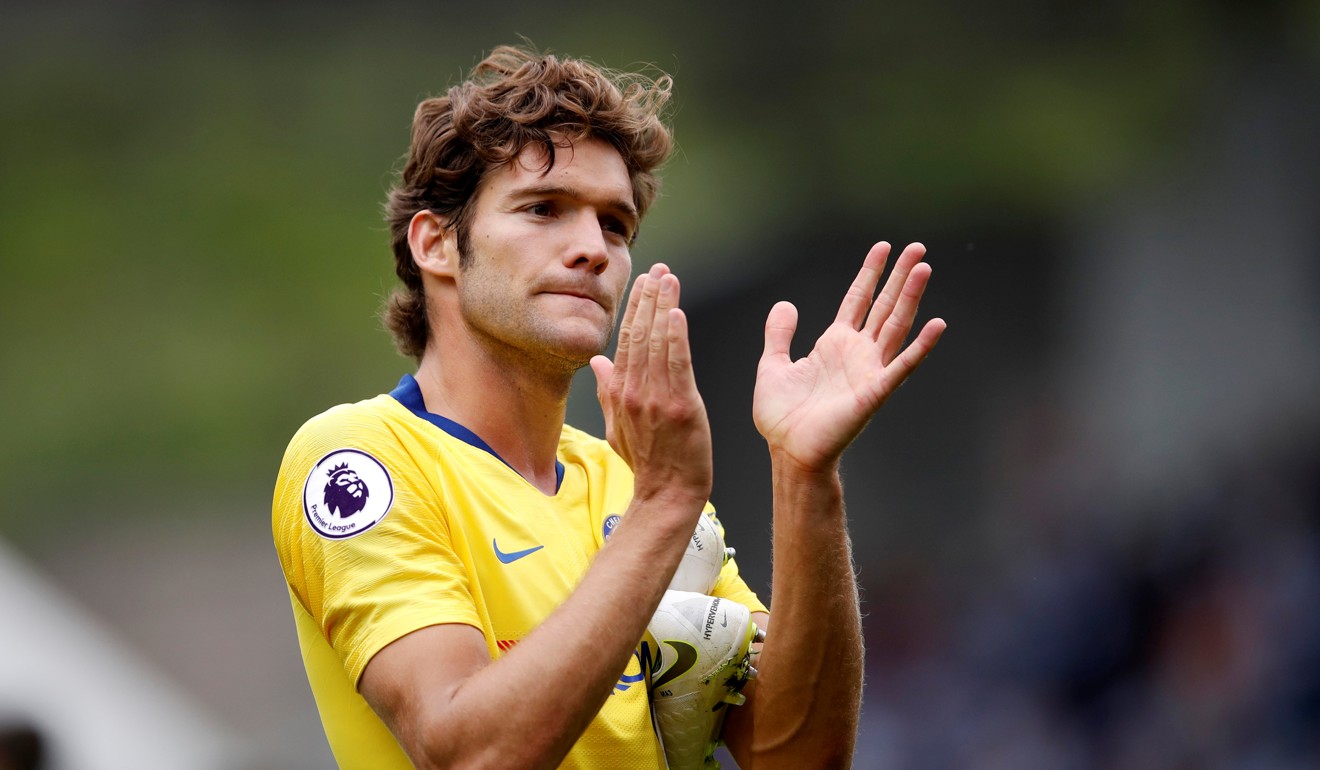 Marcos Alonso applauds the Chelsea fans after their win at Huddersfield. Photo: Reuters