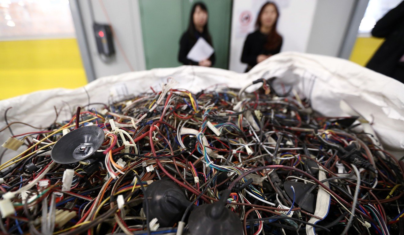 Wires and components of discarded equipment is seen during the media briefing and tour of the waste electrical and electronic equipment (WEEE) facility in Ecopark in Tuen Mun. Photo: Nora Tam