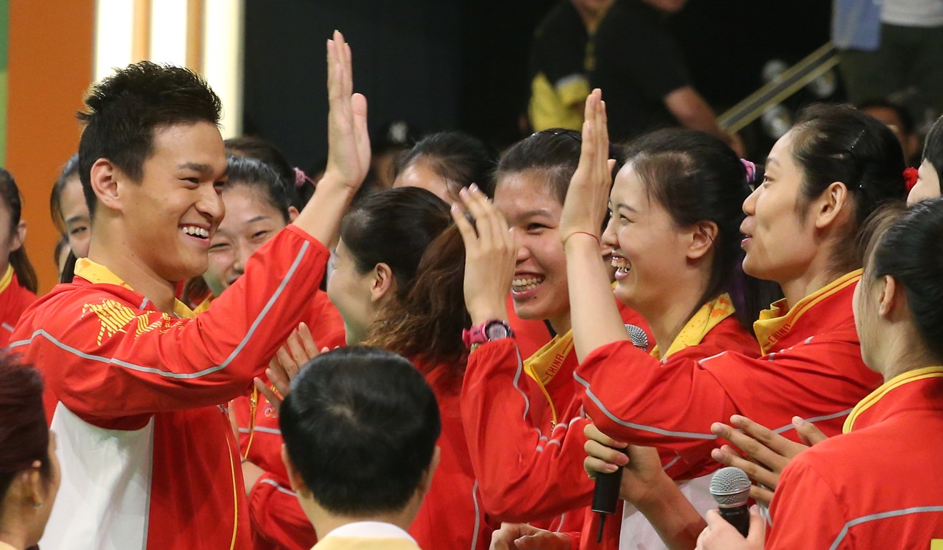 China star swimmer Sun Yang (left) greets the Chinese women's volleyball team in Hong Kong in 2016. Photo: Felix Wong
