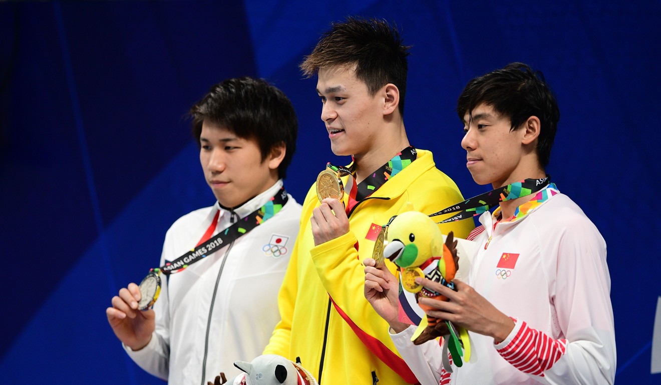 Sun Yang on the podium after winning the men’s 800m freestyle. Photo: AFP