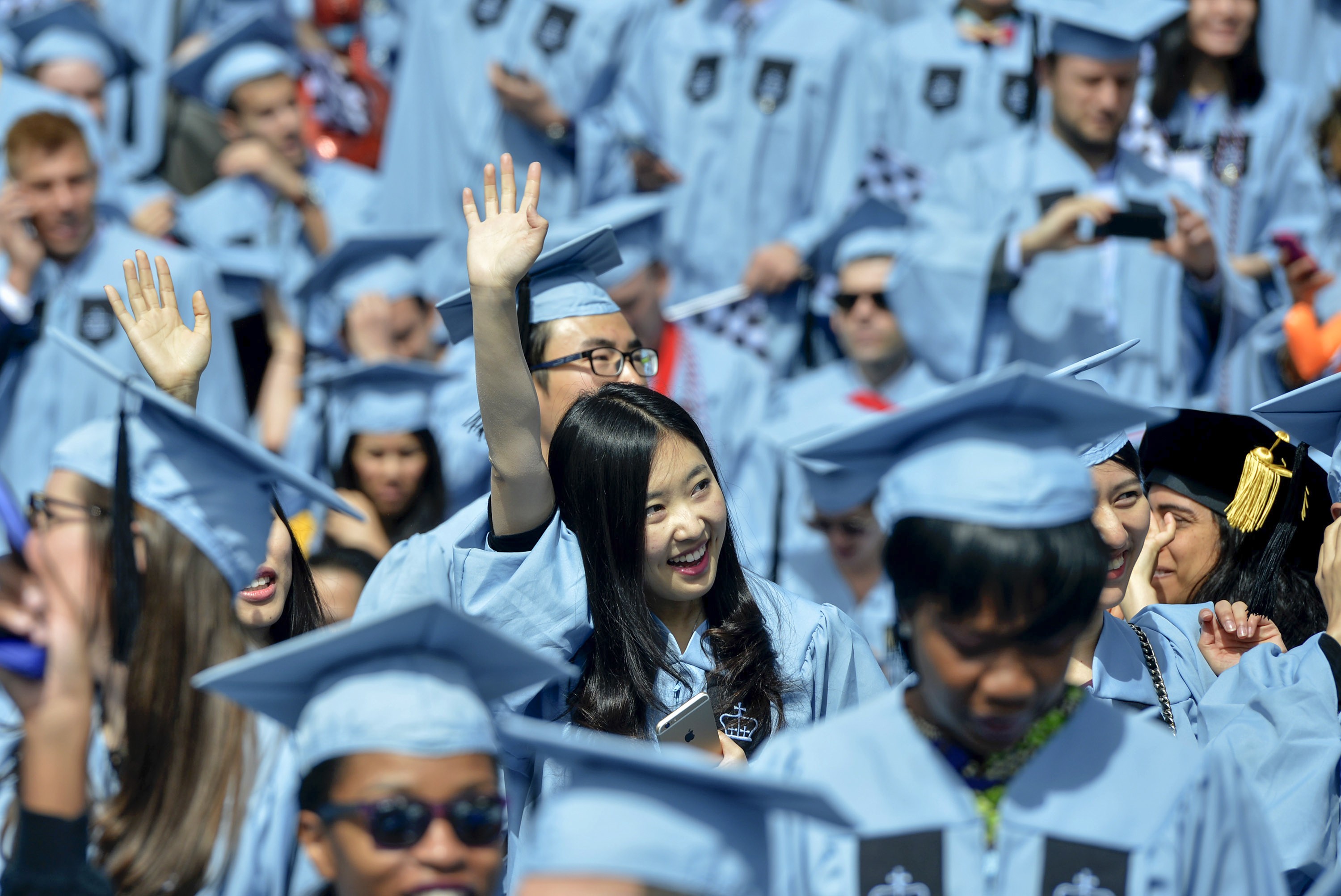 Chinese graduates of Columbia University attend the commencement ceremony in New York City in 2015. Improvements in education attainment have encouraged more women to strike out on their own. More Chinese are attending university overseas, and many return home to start a business. Photo: Xinhua