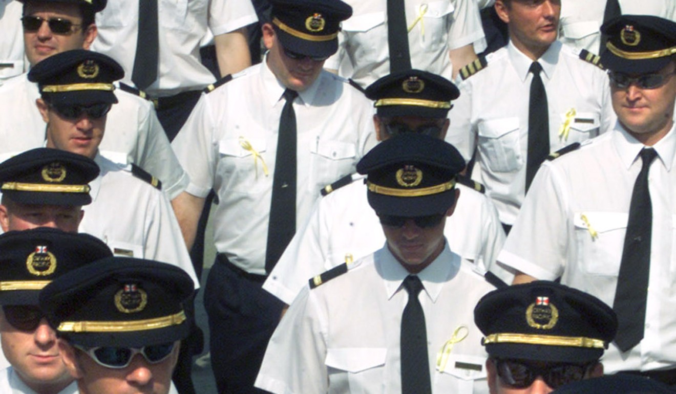 Cathay Pacific Airways pilots march to a meeting in Hong Kong on August 22, 2001. Photo: Reuters