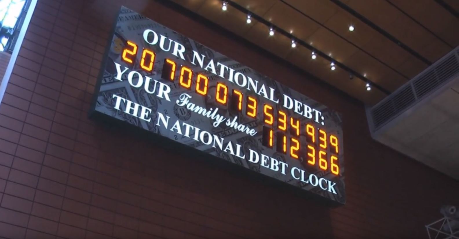 A billboard with a ticker keeps track of the US national debt. Photo: YouTube