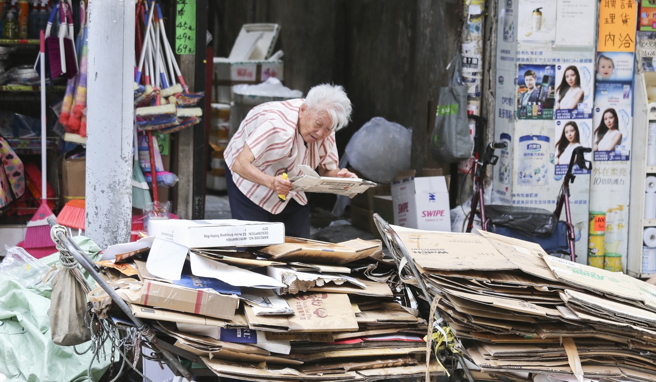 A ‘cardboard granny’ ekes out a living in North Point. Photo: Dickson Lee