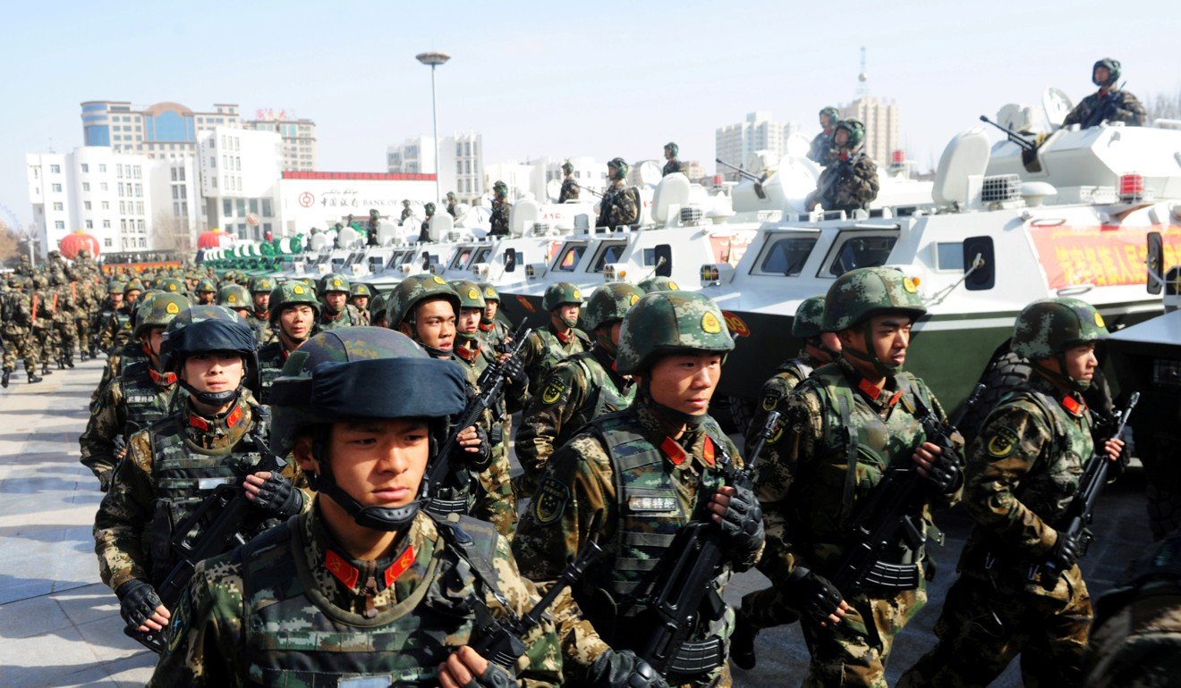 Paramilitary police take part in an anti-terrorism oath-taking rally in Kashgar, Xinjiang last year. Beijing has blamed separatists for violent attacks in the region. Photo: Reuters