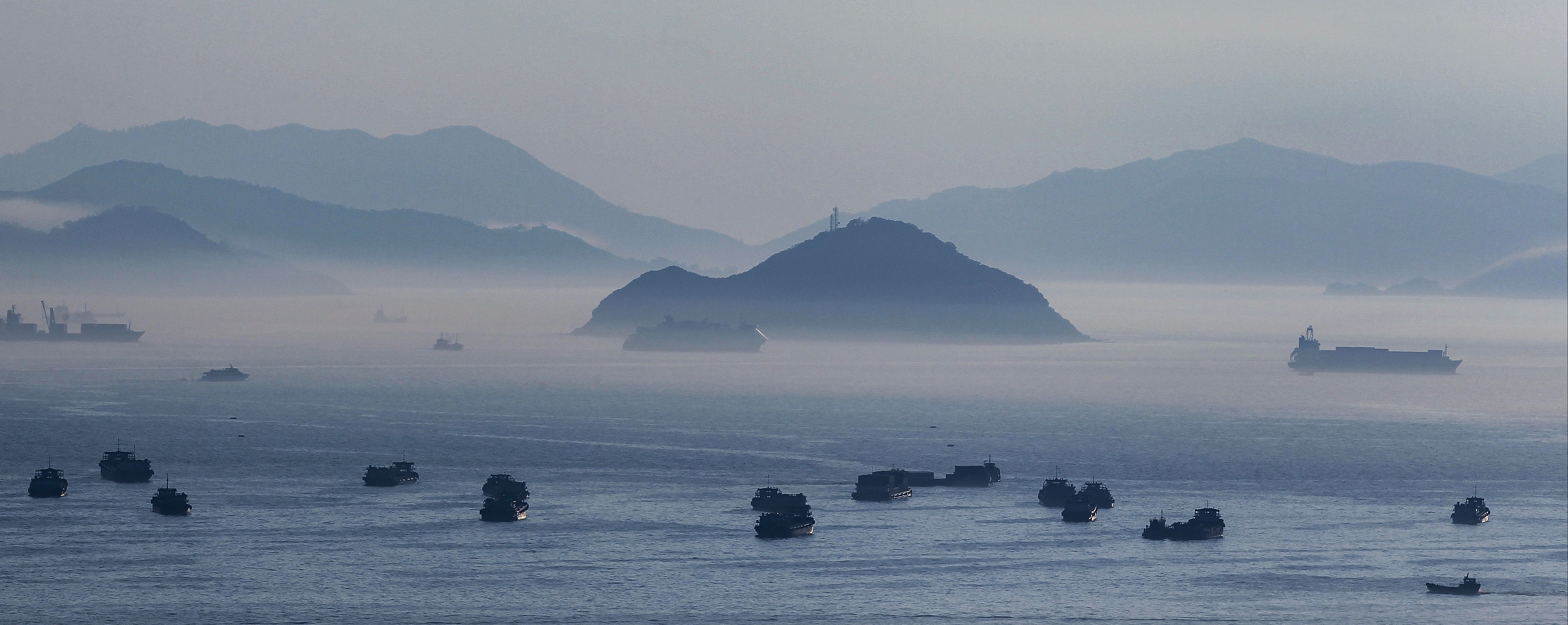 Fog surrounds Lantau Island in the distance as seen from Tai Kok Tsui. Our Hong Kong Foundation has proposed the reclamation of an artificial island to the east of Lantau Island to address Hong Kong’s housing and development needs. Photo: Roy Issa