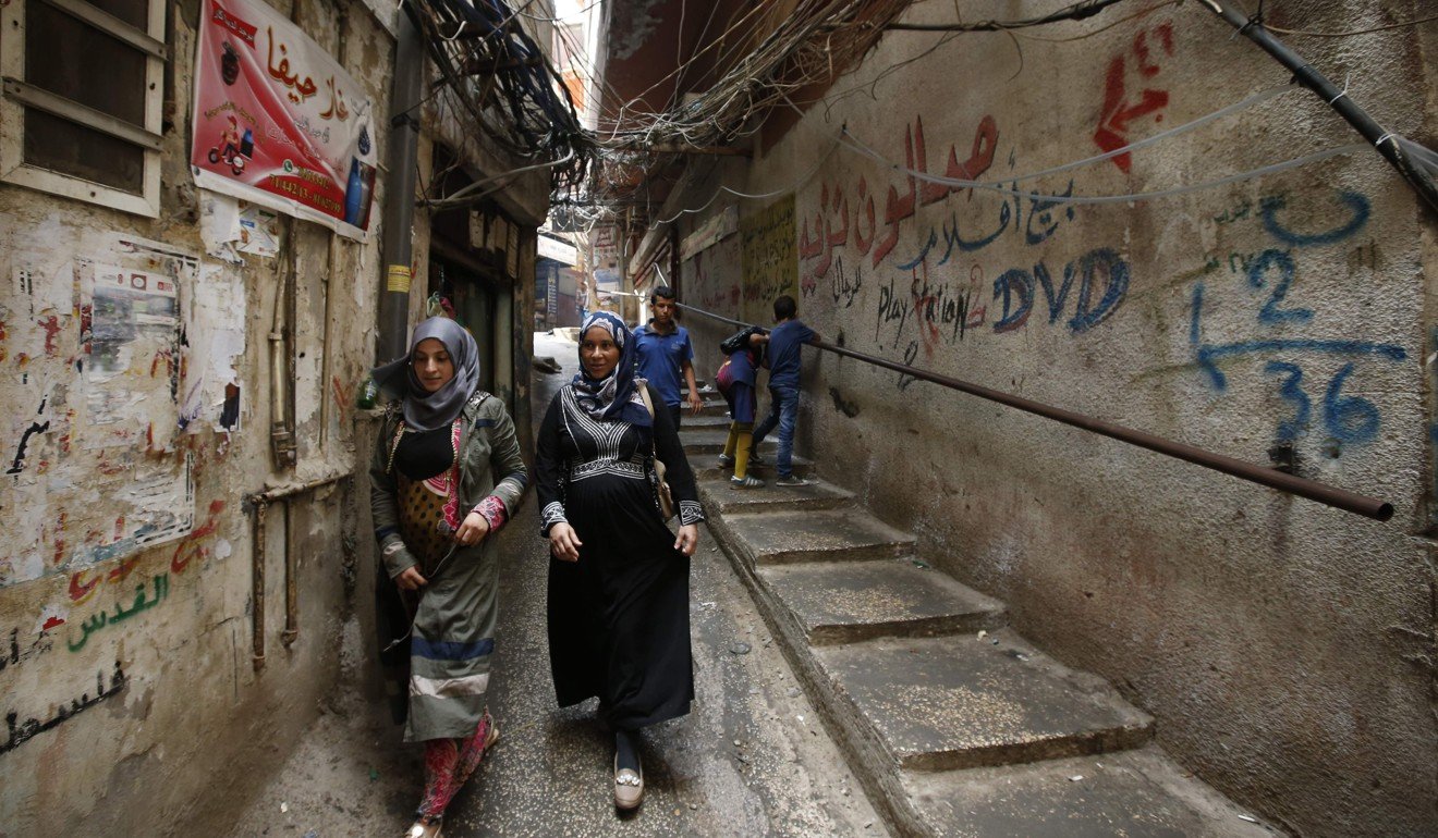 Women on a street in the Palestinian refugee camp Burj al-Barajneh. Photo: AFP