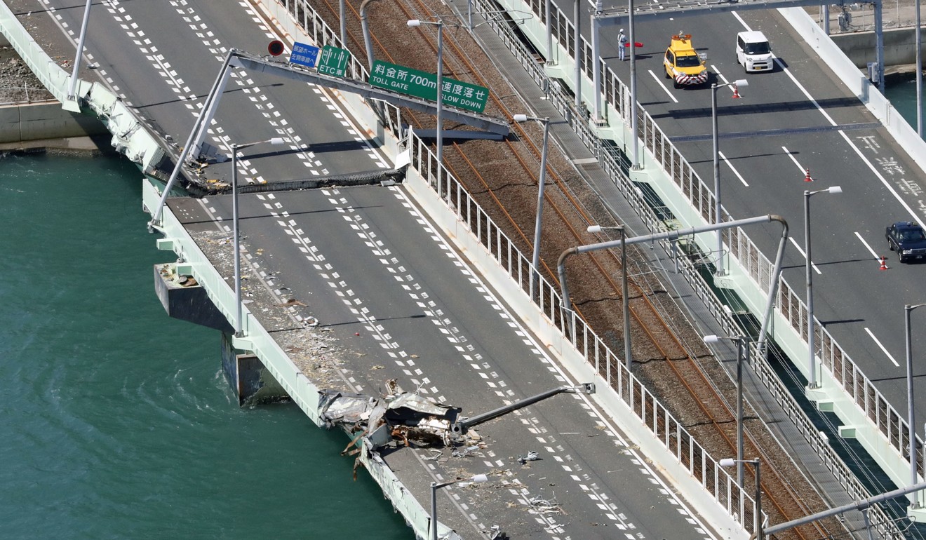 Damage is seen on the bridge linking Kansai International Airport’s artificial island with the mainland, after Typhoon Jebi caused a tanker to crash into it. Photo: Kyodo