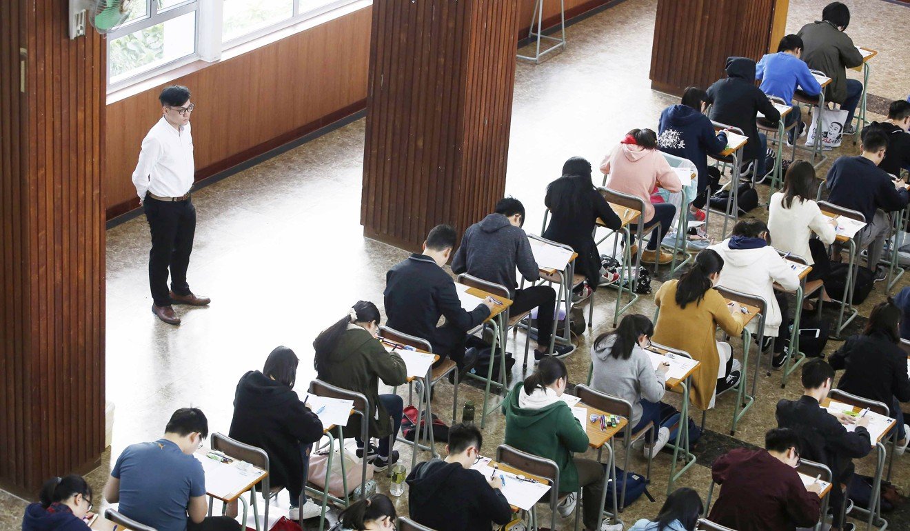 Students take the Hong Kong Diploma of Secondary Education examination at Kiangsu-Chekiang College in North Point. The exam-oriented school system has been blamed for the increase in suicides among young people. Photo: Handout