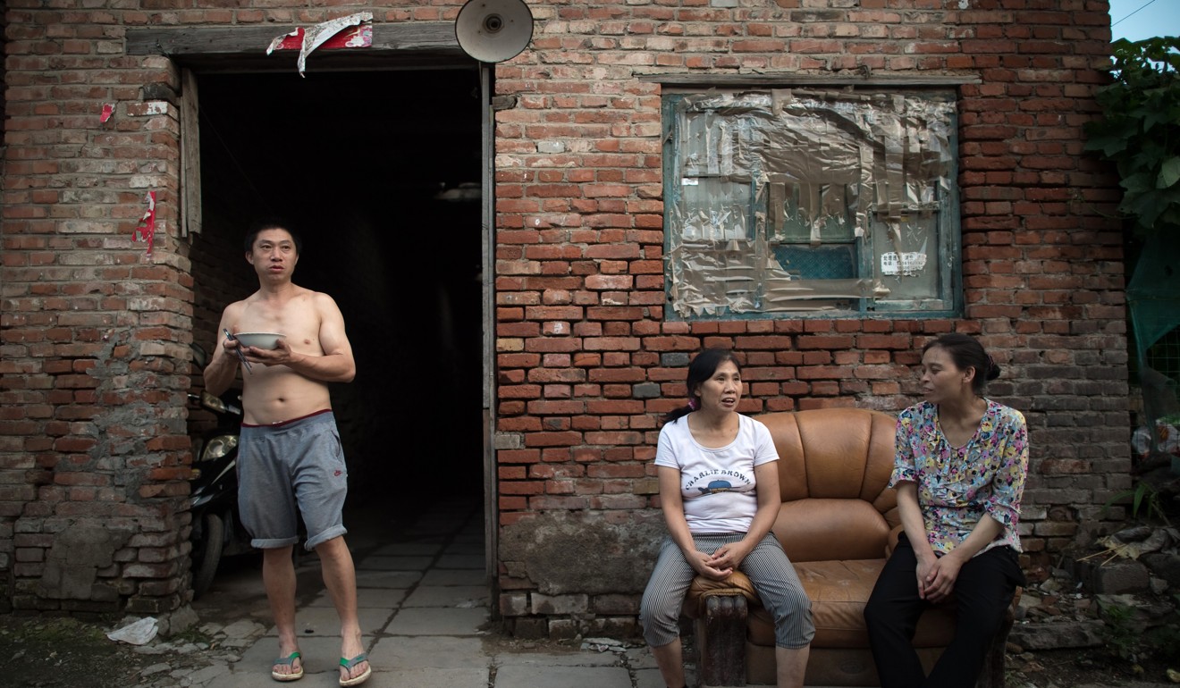 A migrant village on the outskirts of Beijing. According to Chinese officials, the lower- and middle-income population will greatly benefit from the tax changes. Photo: AFP